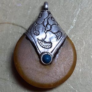 Tibetan Silver Repoussé & Beeswax Amber Pendant